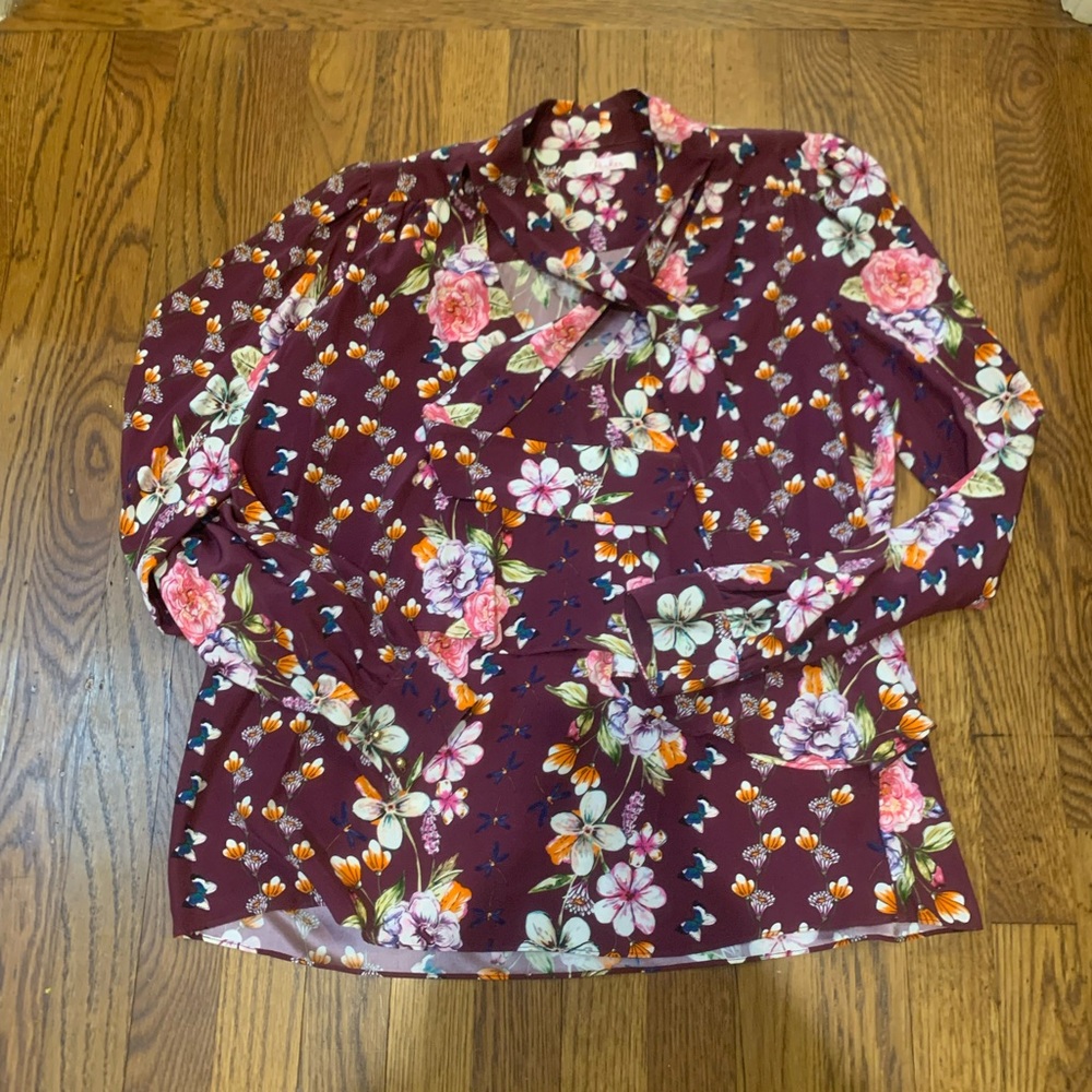 Fun and flirty 100% silk Parker blouse with butterfly and flower print.